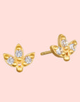 White topaz lotus studs: gold plated earrings with a three-leaf lotus design, each leaf set with a sparkling clear white topaz stone, displayed on a white background.