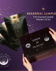 Hands hold a black “Magic Hour” box labeled “Open for Magic,” next to three black tea pouches. Text: “SEASONAL TEA CLUB SUBSCRIPTION—8-10 curated tea sample pouches.” Purple backdrop with stars and sparkles.