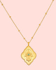 16" Emerald Hamsa Pendant Necklace with 3" extension chain features a Hamsa hand pendant adorned with an engraved eye and central emerald, hanging from a delicate beaded chain—a modern, elegant twist on the classic evil eye necklace.