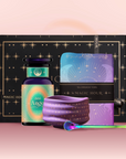 The Angel Numerology Fruit & Flower Tea Gift Set features a bottle labeled "888 Angels," a star-patterned cloth, a multicolored tea scoop, and a decorative booklet—all with mystical pastel designs on a pink background.