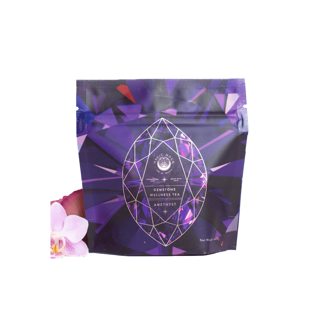 A purple and blue geometric patterned package of "Rest, Relaxation & Sleep Sampler Set" labeled "Amethyst." The packaging features a large, faceted gemstone graphic. An orchid flower is partially visible at the bottom left. This organic loose leaf tea weighs 4 oz.