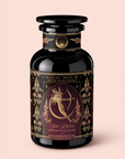 A beautifully designed black tea canister labeled “Artemis of the Wilds: Wild Moon White Tea” features ornate floral patterns and an illustration of Artemis, the archer. Inside is a celestial blend of moonlight white tea delicately infused with hints of butterfly pea flower.