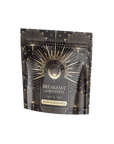 A black pouch labeled "Breakfast with Benefits: Blood Sugar Balance" features gold floral designs, highlighting Gymnema Sylvestre and Assam. A circular logo enhances the luxurious allure of this sealed package.