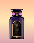 A dark purple glass bottle labeled "Magic Hour: Child’s Pose™ Herbal Adaptogen Tea Blend for Sleep & Restful Calm" rests against a peach-yellow gradient, with gold celestial designs and elegant text evoking aromatherapeutic tranquility.