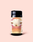 A black tea canister labeled "Tea for Rest: Venus: Mango Blossom & Nervines Herbal Tea" features a sun, butterflies, and floral design on a light pink background. The label highlights "Adaptogen Relaxation Tea" and "5 Plant Silk Tea Sachets." This soothing herbal blend includes organic chamomile to support relaxation and collagen production for a restful experience.
