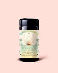 A light pink container of Tea for Calm: Mantra Mint—organic herbal tea with mint, rose, and vanilla. The sun and floral-illustrated label notes 5 plant-silk sachets inside, making this a soothing choice.