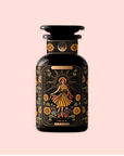 A dark glass jar labeled "The Sun: Energizing Adaptogenic Herbal Tea with Yaupon, Moringa & Turmeric" features vibrant artwork of a woman in a flowing dress with sunflowers and foliage on a pale pink background.