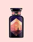 A dark purple "Turkish Delight" perfume bottle with a gold label showing domed Istanbul buildings, reading "Black Tea, Turkish Delight," evokes luxurious Turkish tea and sweets on a light pink background.