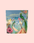 A vibrant pouch for Tulum Horchata Chai featuring illustrated tropical birds, flowers, and greenery on a pastel background with geometric and botanical elements—perfect for this adaptogenic wellness blend.