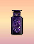 A dark purple perfume bottle, inspired by Amethyst: Strawberry-Passionfruit Gemstone Wellness Tea, features a geometric faceted label and shiny cap with gold accents, set against a peach-yellow gradient background evoking spiritual clarity.