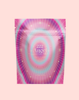 A resealable pouch labeled "222: Hibiscus-Papaya Oolong with Roses" features radiant pink, purple, and teal hues, gold stars, and sunbursts on pale pink—an eye-catching treat for hibiscus tea enthusiasts.