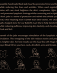 A dark-colored graphic featuring text promoting Magic Hour's Butterfly Beauty Gua Sha, highlighting its benefits like firmer and brighter skin, reduced fine lines and wrinkles, and improved lymphatic drainage. Illustrations depict using the tool on the face, neck, décolleté, arms, and breasts while sipping Organic Tea.