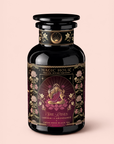 A black jar labeled “Magic Hour Teas of the Divine Feminine” features floral designs and an illustration of Lakshmi. This luxury black tea is called “Lakshmi in Abundance: Rose Saffron Black Tea for Good Fortune & Radiance,” offering an antioxidant-rich tea experience inspired by abundance and grace.