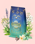 A blue and gold Mercury Mint Nighttime: Vanilla Mint Lavender Jasmine Tea Refill Pouch is surrounded by illustrated herbs, flowers, mint leaves, vanilla, and cloves—perfect for digestion support—all set against a pale pink background. This calming blend is naturally caffeine-free.