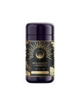 A cylindrical bottle with a purple cap showcases sun rays and "Metabolism Balance: Breakfast with Benefits" on the label, emphasizing its blend of bold black tea and metabolism-boosting spices.