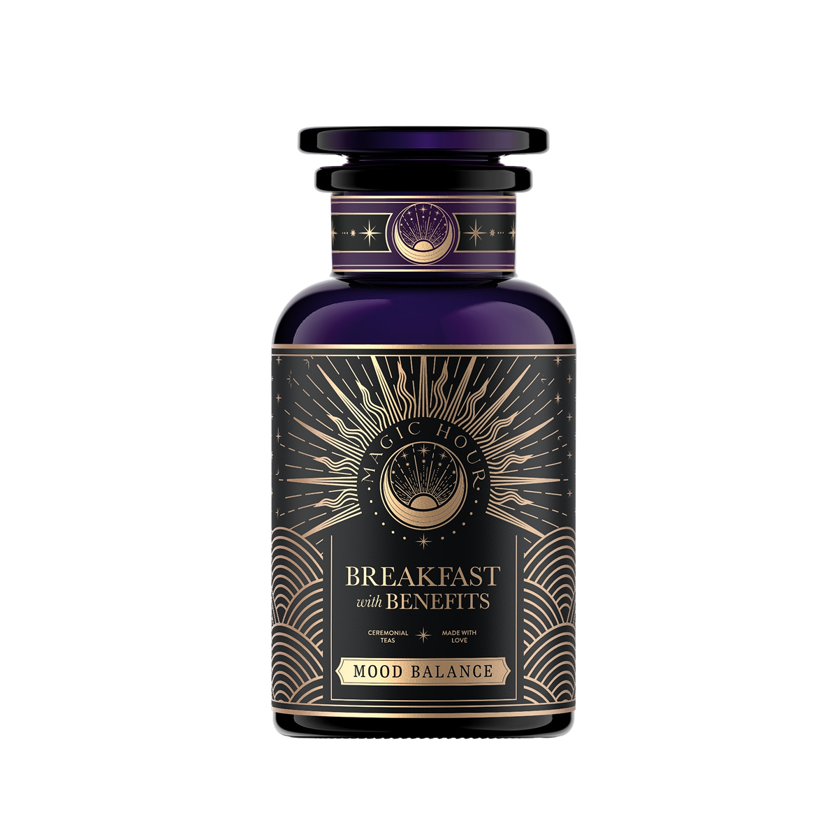A dark, elegant jar labeled "Mood Balance: Breakfast with Benefits" features gold and white accents with sunburst patterns and wave motifs, suggesting the calming effect of Ashwagandha root for tranquility in every sip of this herbal tea.
