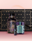 Experience celestial beauty with The Moon Bath & Beauty Box, featuring a luxurious black box with gold stars, a decorative bottle, small roller, and the "Midnight Moon" jar—all presented against a pink backdrop.