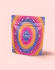A light pink, starry rainbow pouch labeled "555: Celestial Harmony: Papaya-Mango-Rose Tea with Ashwagandha," featuring "MAGIC HOUR" and "FOR WEIGHT LOSS AID"—perfect for herbal blends that support stress relief.
