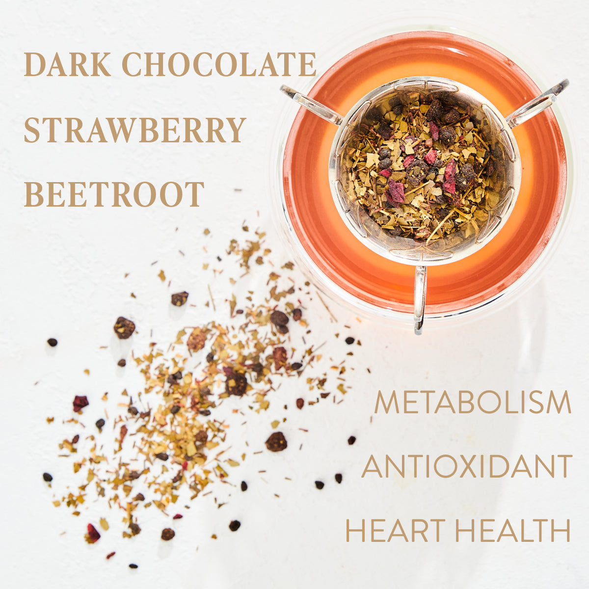 A glass of orange tea is topped with a Queen of the Rainforest Cacao-Berry Tea Refill Pouch infuser, featuring a blend of dark chocolate, strawberry, beetroot, and Guayusa—an energizing herb from the Ecuadorian Rainforest. Some of the tea blend is scattered on the white surface. Text around the image reads "Dark Chocolate, Strawberry, Beetroot, Metabolism, Antioxidant, Heart Health.