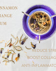 A clear glass cup contains vibrant purple Sapphire tea, with tea leaves and flower petals scattered on a white surface. Text reads "Magic Hour" and "Sapphire - Apple-Plum-Spice White Tea" with benefits such as reducing stress, boosting collagen, and anti-inflammatory properties.