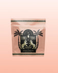 A pink resealable pouch labeled "Summer Fridays™: Strawberry Daiquiri," featuring palm tree and zebra art on a soft pink gradient, highlights this mocktail-inspired tea blend.