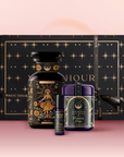 The Sun Bath & Beauty Box is a luxury gift set in a black box with gold stars, featuring a bottle, jar, and lip balm—each decorated with celestial sun-themed labels on pink, infused with adaptogenic botanicals.