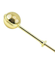 A Golden Wand Tea Strainer from Magic Hour with a perforated spherical compartment and a long handle. The handle, perfect for brewing Magic Hour Tea, ends in a small round knob and has an additional larger round knob at the midpoint for easy gripping. The spherical compartment splits open to hold loose leaf tea.