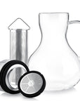 The Teabloom Multi-brew Glass Teapot + Kettle + Pitcher (51 oz) features a clear glass pitcher with handle, stainless steel infuser, metal lid, and mesh filter lid for versatile tea or infused beverage preparation.