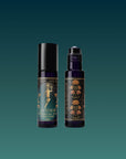 Two Hathor of Joy: Honey Nectar Herbal Tea dark glass roll-on bottles with black caps and ornate gold floral label designs are set against a gradient teal background. One bottle is open, revealing the rollerball applicator.