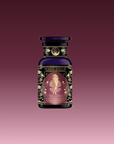 A dark glass bottle of Magic Hour’s “Aphrodite’s Alchemy: Damiana & Rose White Tea,” adorned with gold floral designs and an Aphrodite-inspired image, evokes beauty and pleasure against a gradient burgundy background.