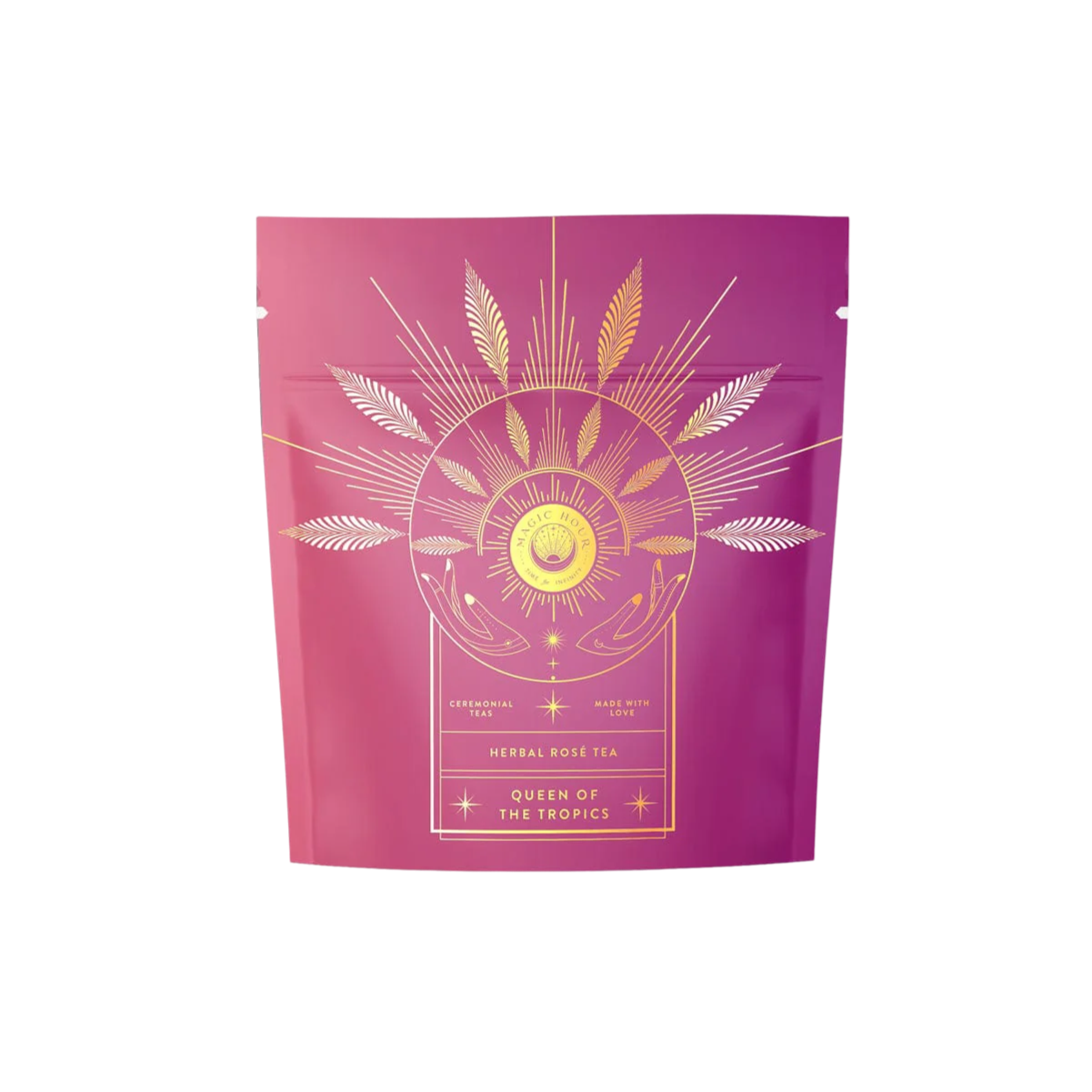 The packaging of this purple tea features gold floral designs with the text "Queen of the Tropics: Rosé all Day Alternative Tea." The design includes stylized leaves, a sunburst pattern, and subtle tropical fruit hints for an invigorating experience.