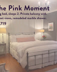 Experience a luminous bedroom in “The Soul of Tea: A Two Day Retreat in Ojai, CA,” featuring a king bed with crisp white bedding, two side tables topped with elegant lamps, a chandelier overhead, artwork adorning the walls, and sunlight streaming through the windows. This luxurious $1,719 escape includes an exclusive signature tea blend, making it the perfect setting for a tranquil tea retreat.
