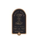 The Magic Hour Front Jar Label is an elegant tea label featuring a dark background with gold accents. The text reads "Magic Hour," "Time for Infinity," "Ceremonial Teas," and "Made with Love." It also highlights the flavors "Coconut Chai" and "Black Tea." The design, ideal as a standalone gold foil front jar label, includes a celestial-themed hourglass.