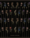 An illustration titled "Magic Hour" depicts various colorful flowers with long stems and leaves, evenly spaced in vertical lines against a black background. The flowers, reminiscent of the delicate beauty found in Magic Hour's Tea Ceremony Towels Bundle, are accented by small stars and intricate border details.
