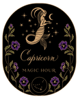 An artistic image featuring a golden mermaid under a crescent moon and stars, representing the Capricorn zodiac sign. The design includes purple flowers along the border and the text "Capricorn" and "MAGIC HOUR." Perfect as a stand-alone gold foil front jar label or for jars to reincarnate their charm, this is the Magic Hour Front Jar Label.