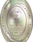 An oval-shaped Magic Hour Front Jar Label for "Magic Hour" gemstone wellness tea. The design showcases an hourglass with stars, moons, and constellations. The text includes "Time for Infinity," "Ceremonial Teas," "Made with Love," "Gemstone Wellness Tea," and "Pearl." Each elegant piece is completed by a stand-alone gold foil front jar label.