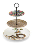 Introducing the Creatures of Curiosity - Tea Ceremony Cake Stand: a stylish serving piece featuring a sleek black central pillar and an elegant round handle at the top. The top plate showcases the Creatures of Curiosity signature floral pattern, while the middle plate boasts a striking leopard print design. The bottom plate is adorned with detailed illustrations of snakes and butterflies.