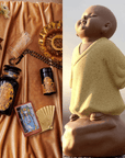 A split image: On the left, a collection of items displayed on a golden satin cloth, featuring The Topaz Gemstone Box, a decorated jar, candle, tarot card, jewelry showcasing November's birthstone - topaz, and flowers. On the right, a ceramic statue of a serene child monk in a yellow robe stands on a stone in a peaceful outdoor setting.