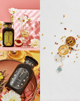 A dazzling and vibrant display featuring the Cosmic Gemstone Apothecary Gift Set, with two exquisite perfume bottles on the left among a burst of flowers and fruit. On the right lies an Emerald Star Tea Strainer accompanied by scattered loose tea leaves and petals. The backdrop showcases lively shades of pink, yellow, and white.