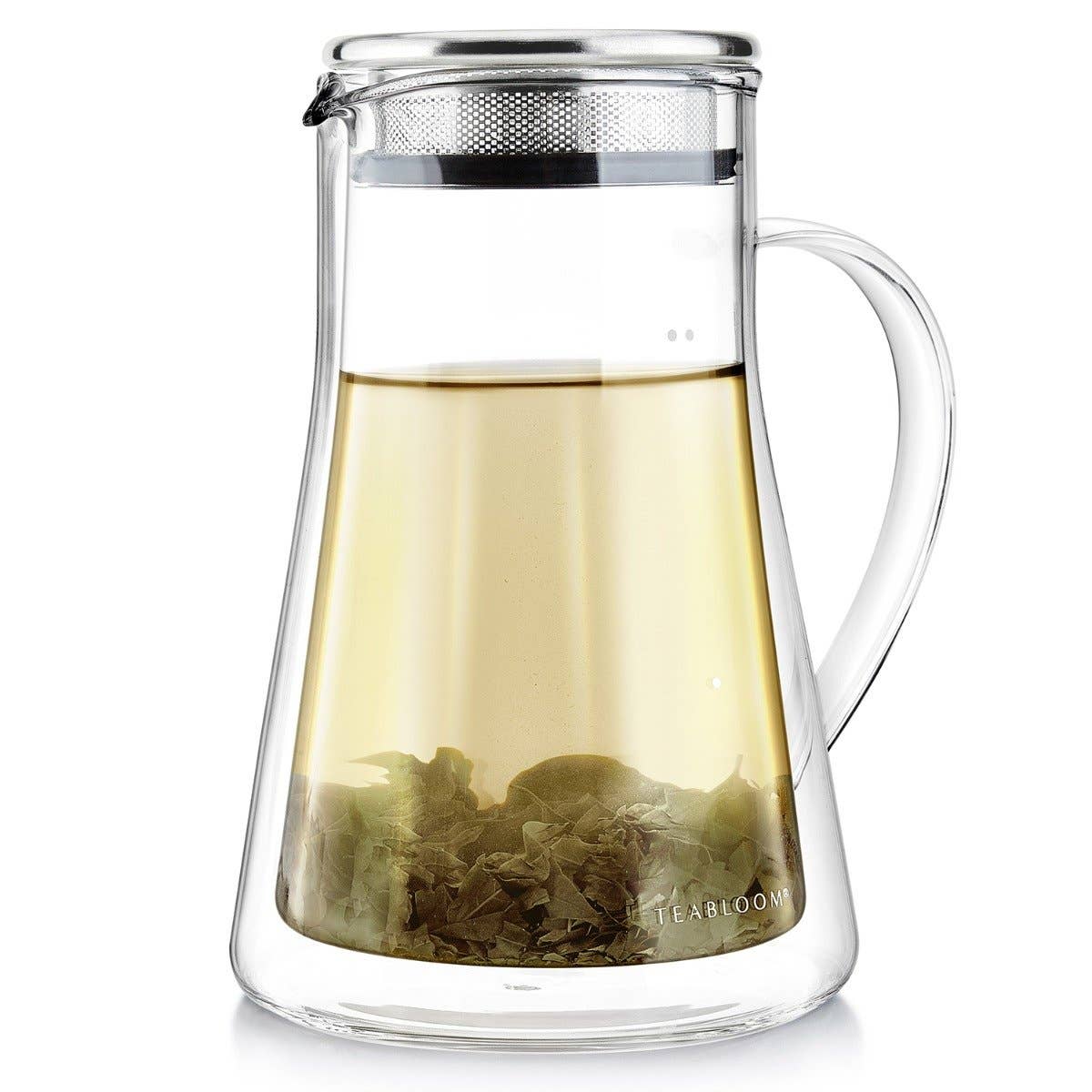 The Teabloom Milano Elegant OneTouch Insulated Glass Tea Steeper features a handle, metal infuser lid, and is shown filled with light-colored loose-leaf tea with leaves settled at the bottom.