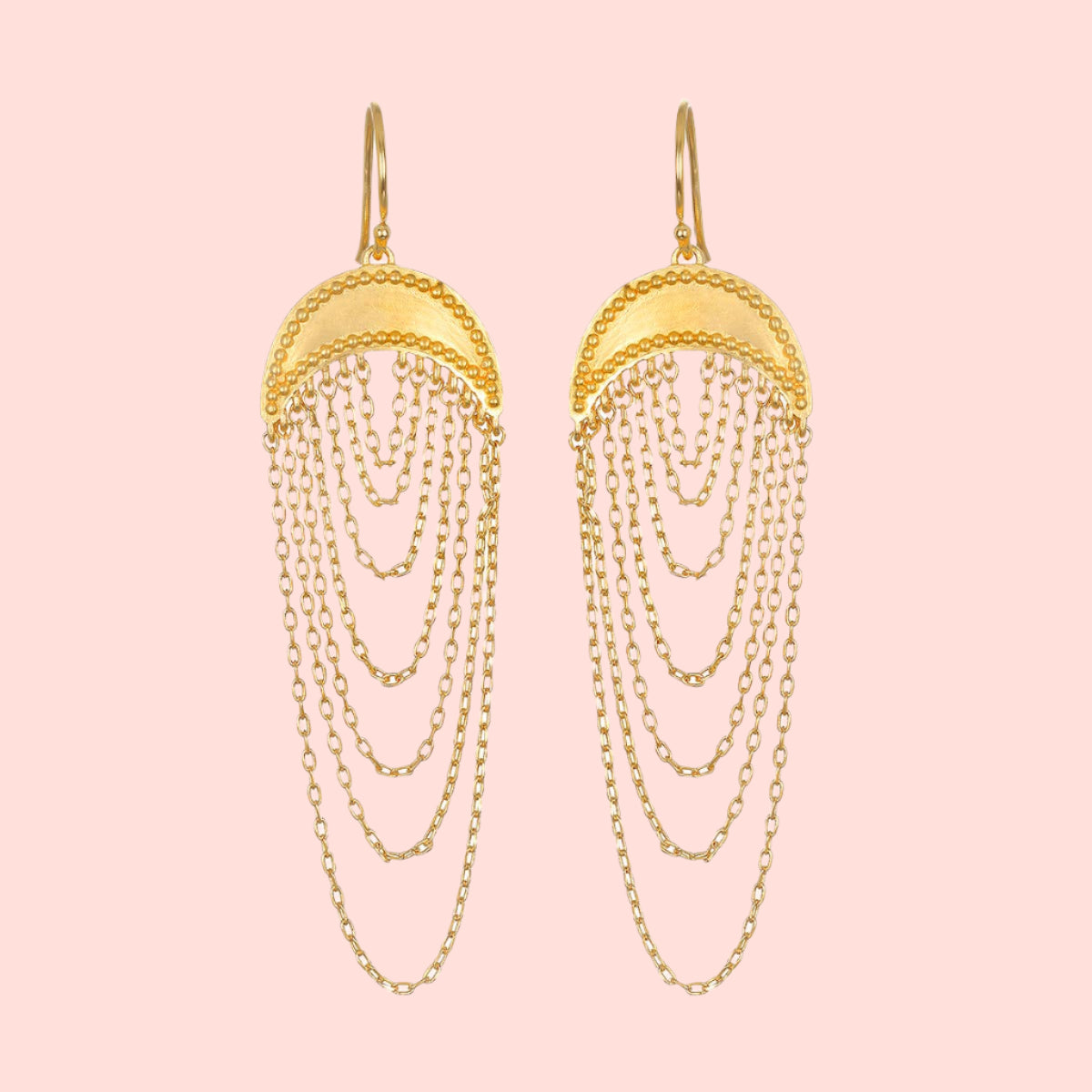 The Drape chain moon earrings feature a half-circle top and layered knife edge cable chains in 18kt gold plate, creating an elegant cascading effect with an intricate and striking design.