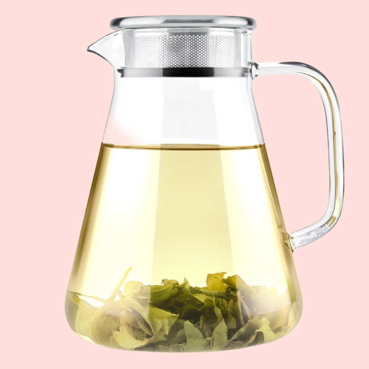 The Teabloom Ceylon One-Touch Glass Tea Maker (40 OZ), made of clear borosilicate glass with a metal lid and handle, is shown with yellow-green tea and loose leaves at the bottom, set against a white background.