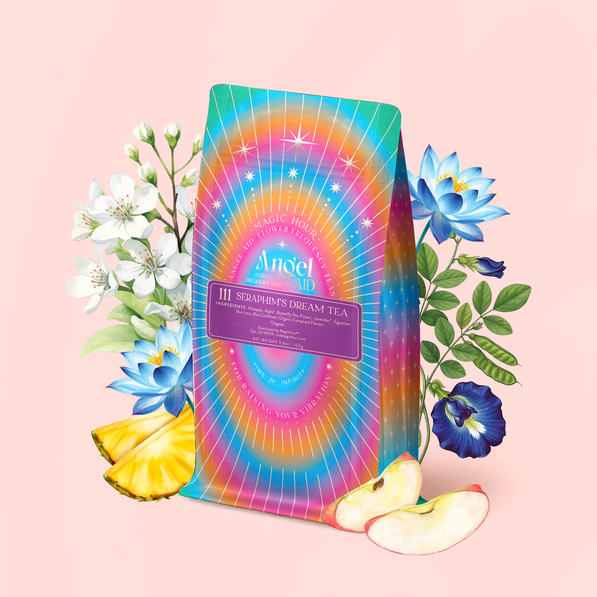 A vibrant tea package labeled “111: Lavender-Jasmine-Pineapple Herbal Tea with Blue Lotus” is surrounded by white and blue flowers, apple slices, and pineapple pieces—all on a soft pink background.