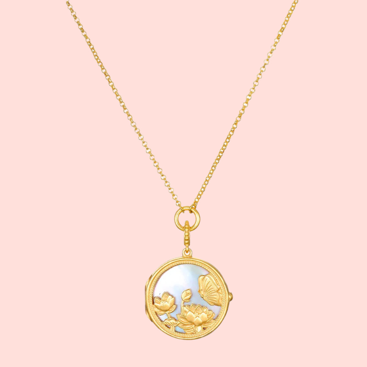 The Take Flight Butterfly Pearl Locket Necklace 18” features a gold chain and a round, mother of pearl pendant adorned with intricate flowers and a butterfly on an iridescent background.