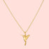 The Loving Devotion Hummingbird Necklace 16" features a detailed pendant on a gold chain, highlighted by a sparkling white topaz accent for the bird's eye and finished in 18k gold plating.