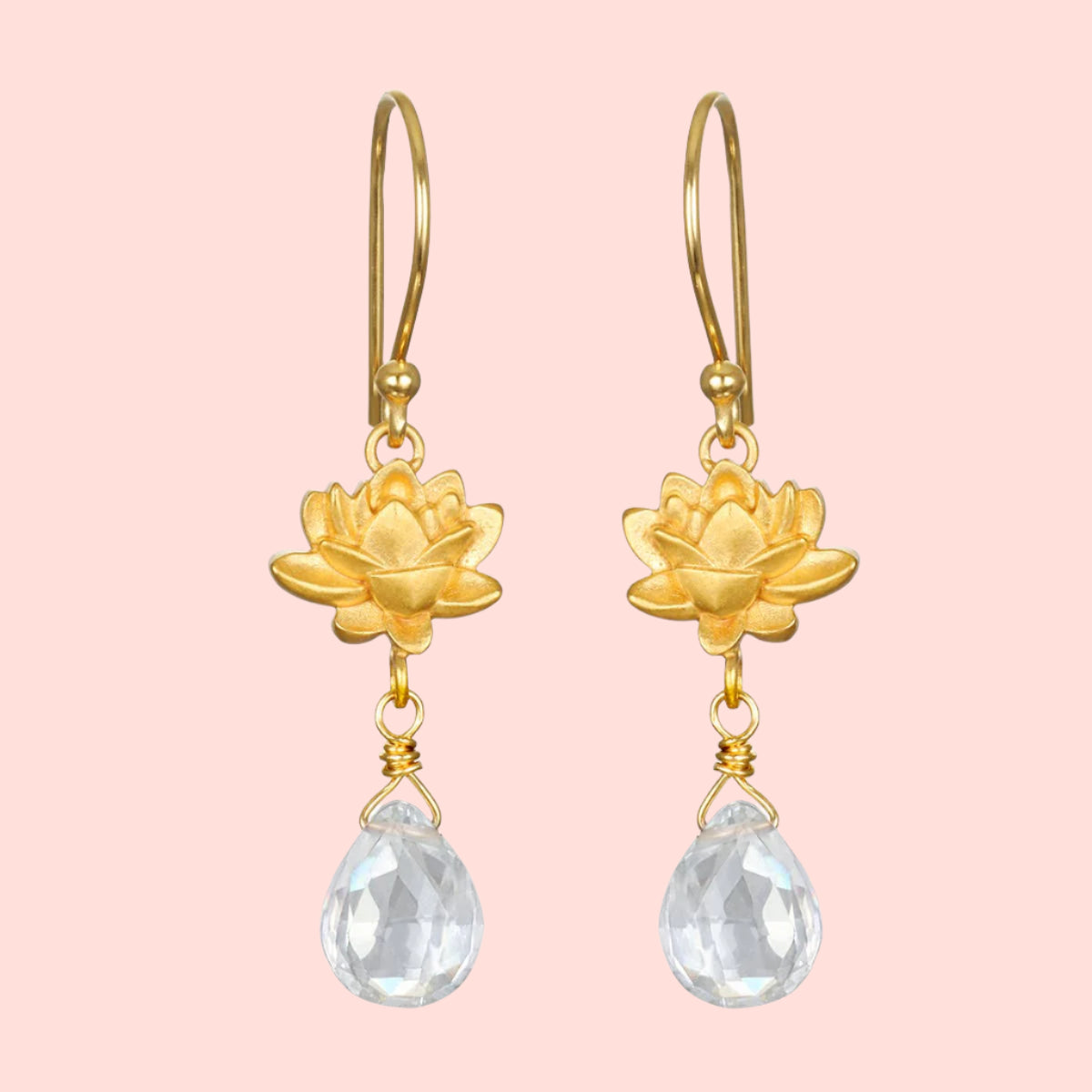 The Spiritual Journey Lotus Crystal Earring features gold-plated lotus flowers with clear teardrop crystal pendants, combining elegance and the charm of crystal healing jewelry, displayed against a white background.
