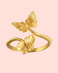 The Freedom to Soar Adjustable Butterfly Double Butterfly Ring showcases two detailed butterfly motifs facing each other on an open band, finished in radiant 18k gold plate for a stunning shine and a perfect adjustable fit.