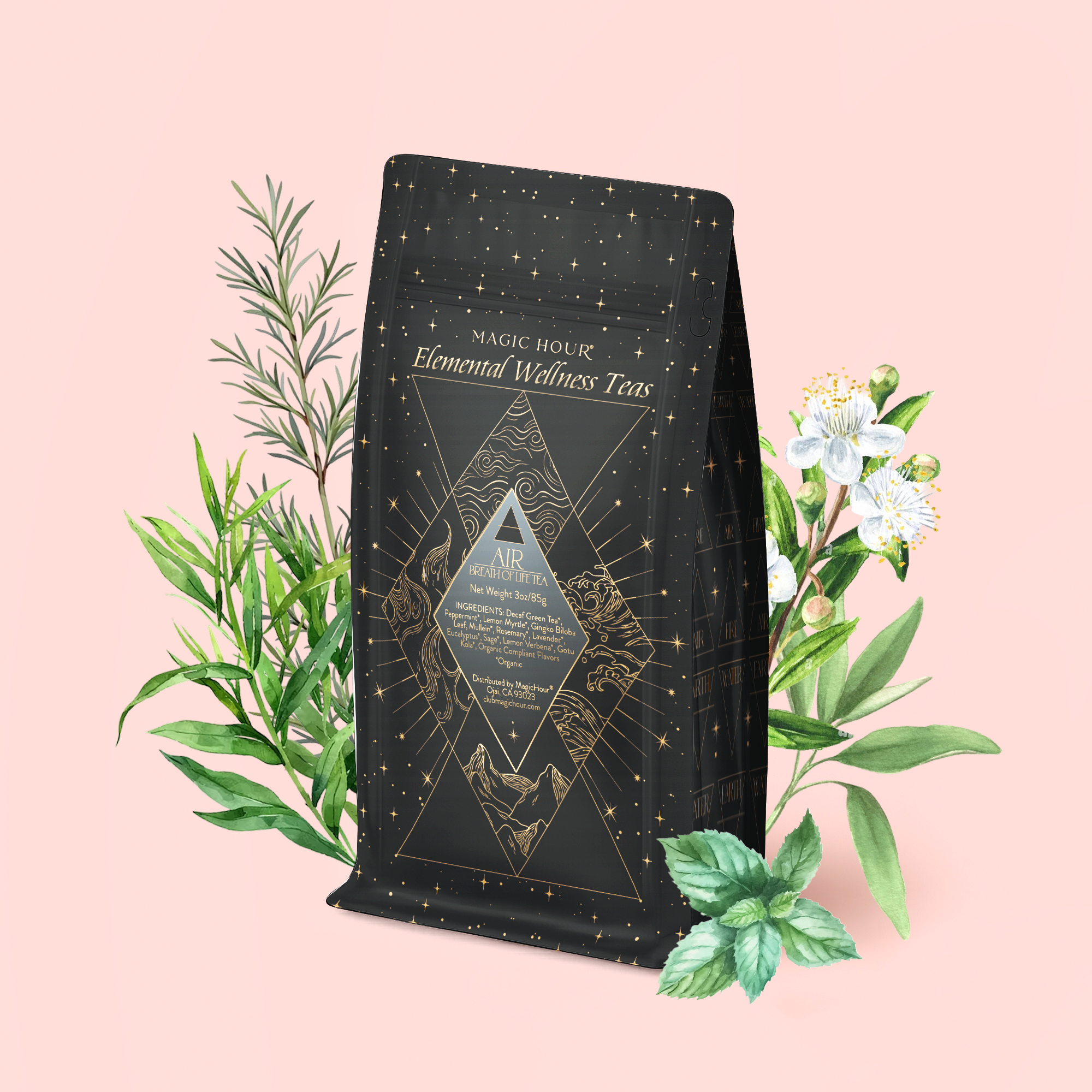 A black and gold tea package labeled "Magic Hour Air: Mint, Mullein &amp; Citrus Tea for Respiratory Support" is surrounded by illustrated green leaves and white flowers on a pale pink background, highlighting its decaf green tea blend crafted to support respiratory health.
