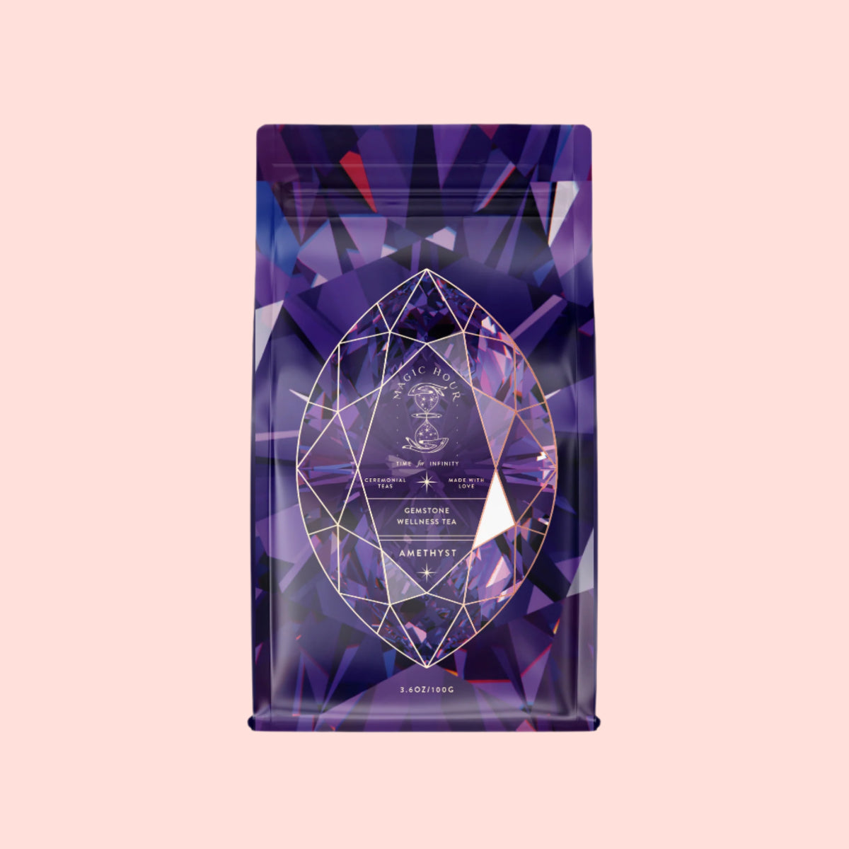 The Amethyst: Strawberry-Passionfruit Wellness Tea Refill Pouch features a purple geometric-patterned bag with a gemstone design and "Amethyst" text, exuding intuition and clarity on its pale pink background, hinting at a premium wellness or tea product.