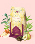 A decorative Apple Crisp Oolong: Cozy & Connected tea bag—a delicious autumn tea—is surrounded by illustrated apples, pears, caramel, tea leaves, and green foliage on a pink background.